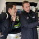 Chad Knaus using his hand to explain something to Mike Rockenfeller.